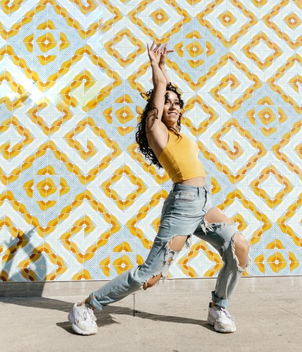 Woman feeling energized and active in a modern urban setting.